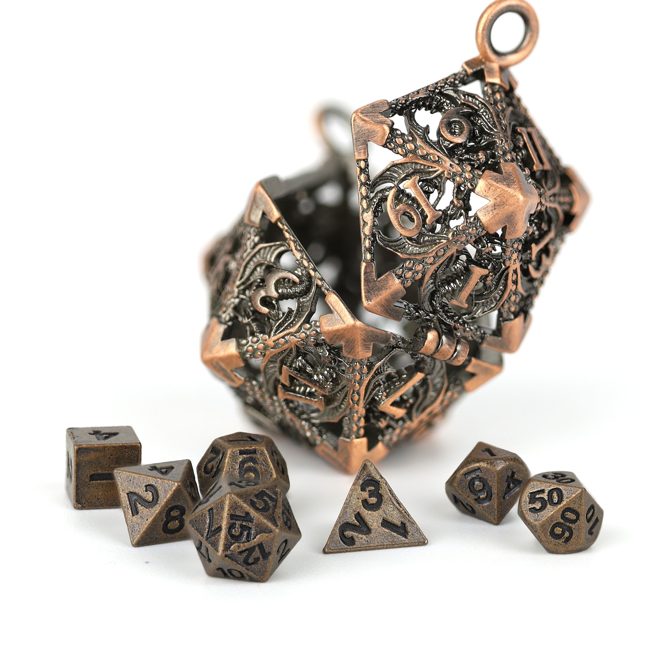 Decorative bronze polyhedral dice set on a white background