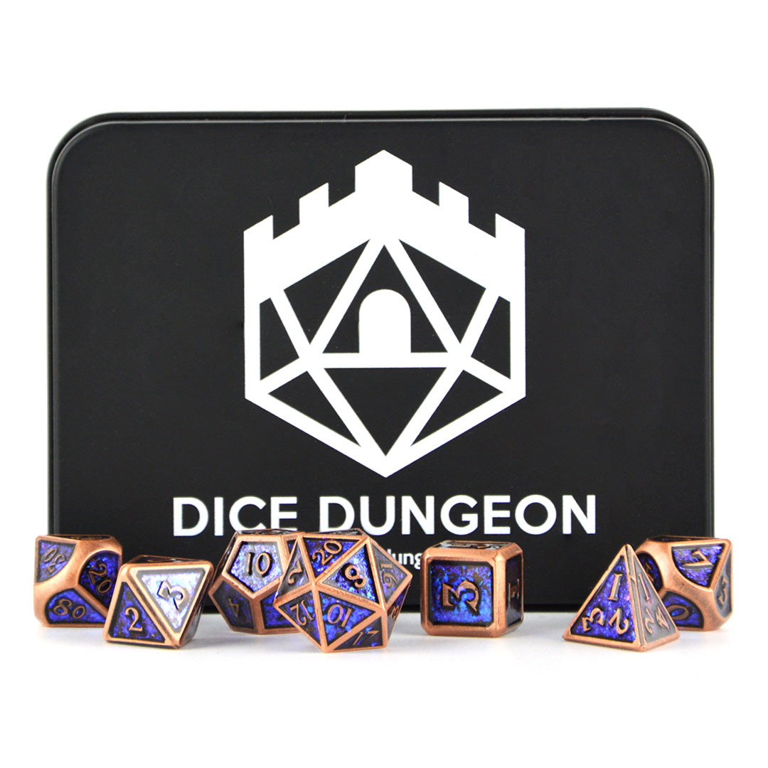 Arcane Blaze 7 piece dnd poly dice set in a bronze / copper finish with blue glitter with a Tin