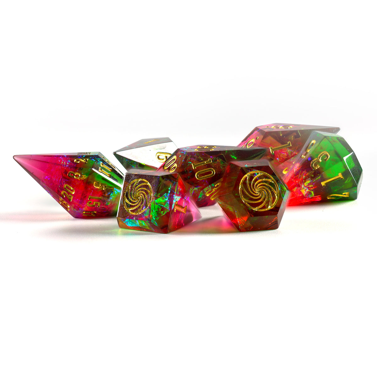 A set of translucent polyhedral gaming dice with gold numbering and swirl motifs, featuring holographic pink, green, and amber iridescent layers, arranged on a white background.