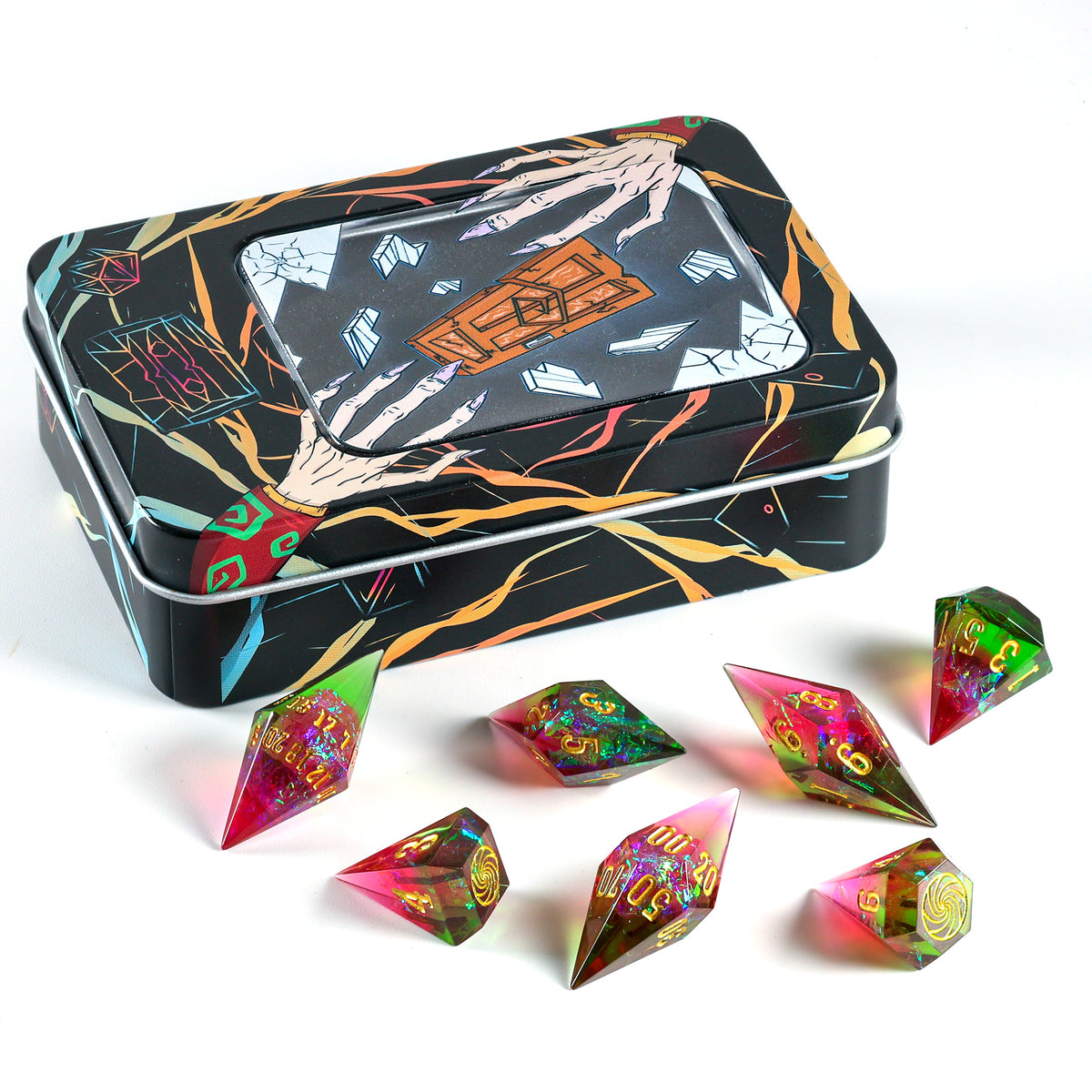 A set of holographic polyhedral dnd dice with a translucent pink and green iridescent finish, arranged on a white surface in front of a decorative black metal tin with colorful line art and a clear window.