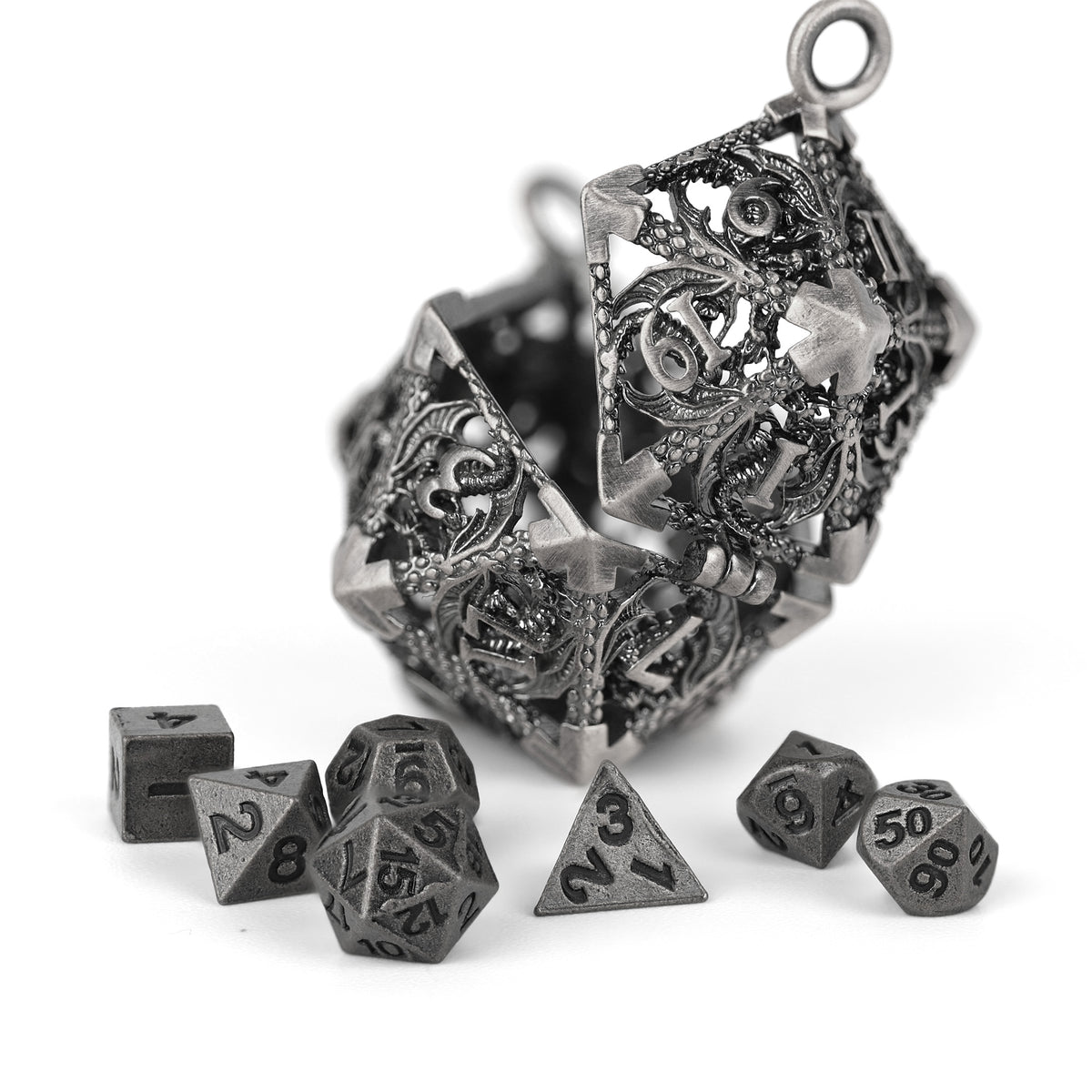 Decorative silver mini metal polyhedral dice set on a white background