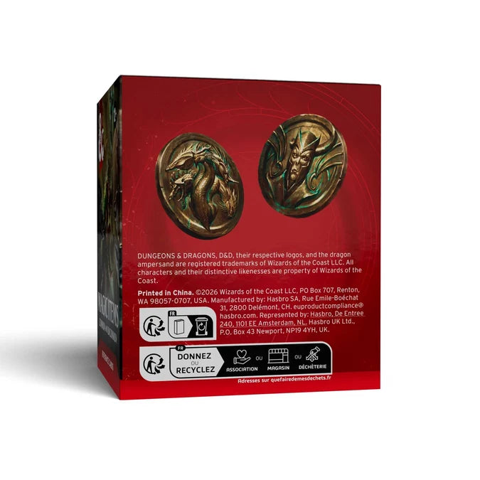 The back of a red Wizards of Coast product box, showing printed artwork of two bronze dragon emblems, small text, and recycling/donate icons, photographed on a light gray background.