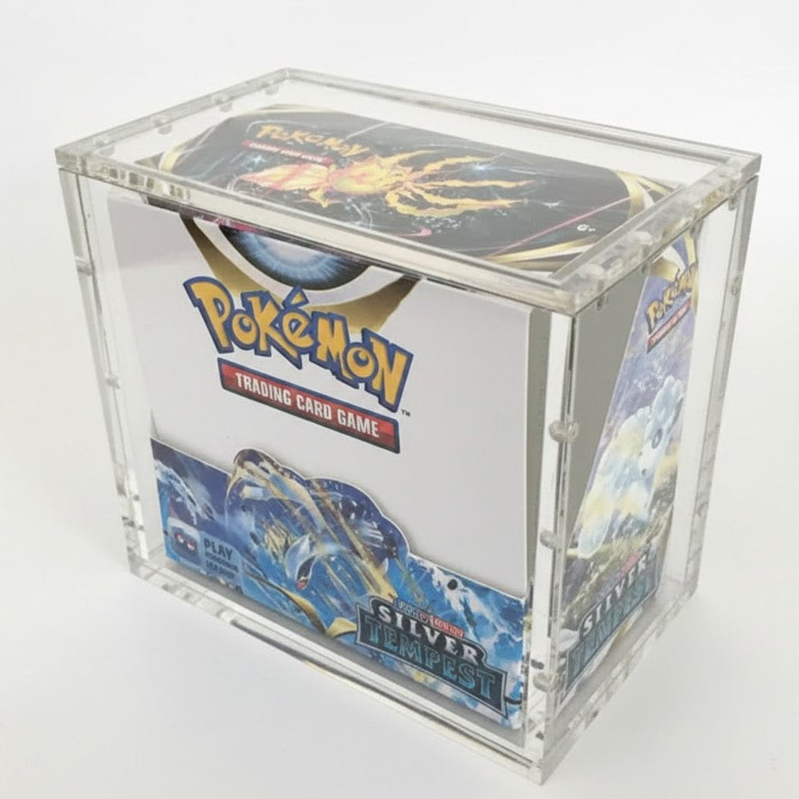 Pokémon trading card game box in a clear display case on a white background